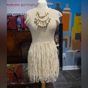 Cream dress with a fringe bottom